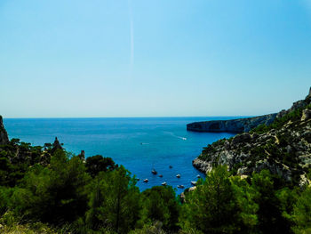 Scenic view of bay against clear sky
