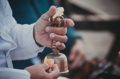 Close-up of hand holding bell