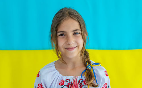 Smiling girl against ukrainian flag