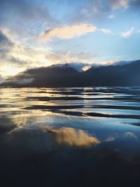 Scenic view of sea against cloudy sky