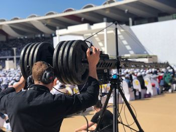 Rear view of man photographing