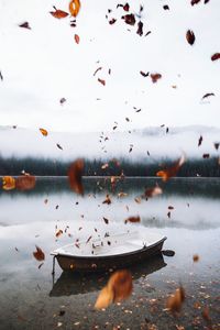 View of boat in lake against sky