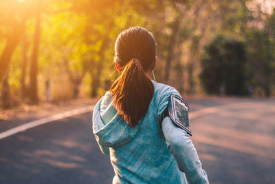 Rear view of woman walking outdoors