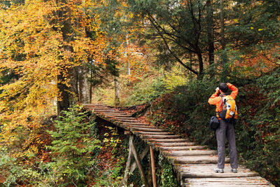 Man standing in forest