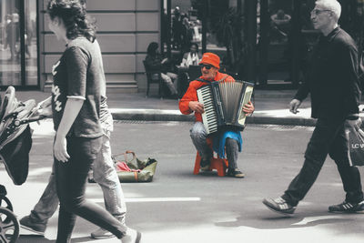 People walking on road in city