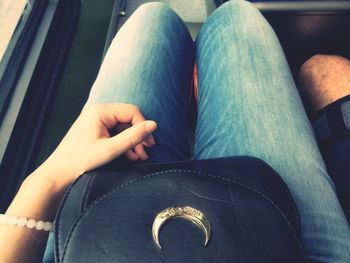 Low section of woman sitting on floor