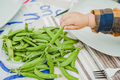 Close-up of hand holding vegetables