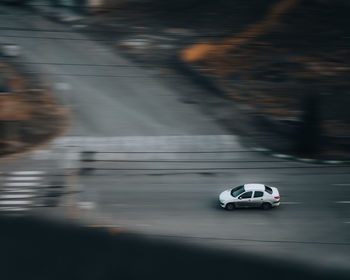 Close-up of car on road