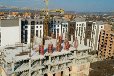 Low angle view of buildings in town against sky