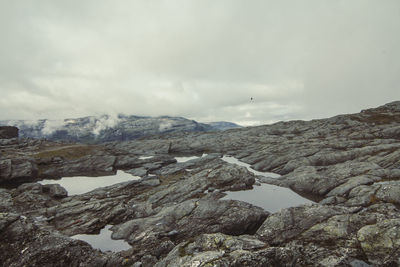 Ponds on rocky mountain slope landscape photo