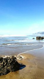 Scenic view of sea against clear sky