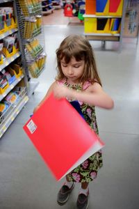 Portrait of cute girl in store