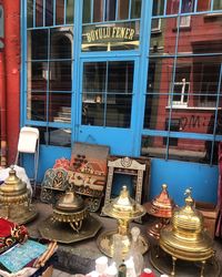 Low angle view of illuminated text on glass window of building