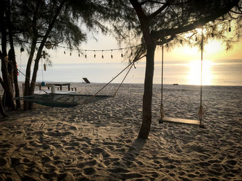 Scenic view of beach against sky during sunset