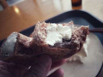 Close-up of hand holding ice cream