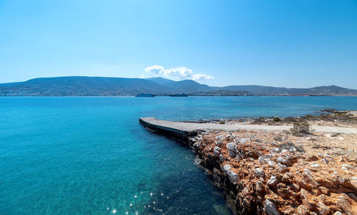 Scenic view of sea against clear blue sky