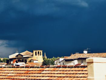 Houses against sky in town