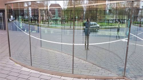 Reflection of man on glass window