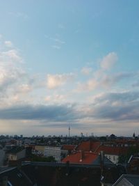 High angle view of houses in town against sky