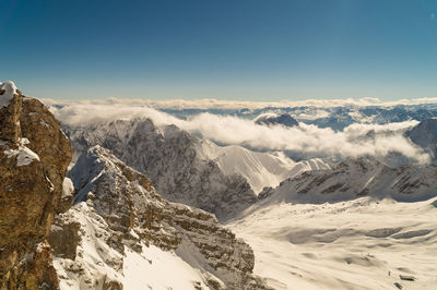 Scenic view of snowcapped mountains against sky