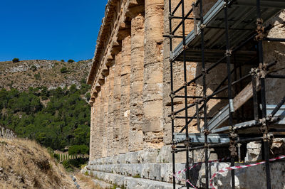 Low angle view of old building against clear sky