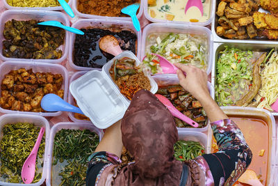 Directly above shot of woman selling street food