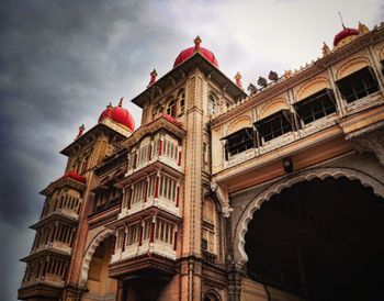 Low angle view of historical building against cloudy sky