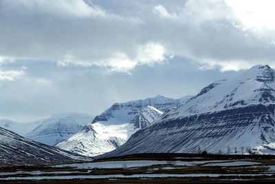 Snow-covered volcanic mountain landscape in iceland