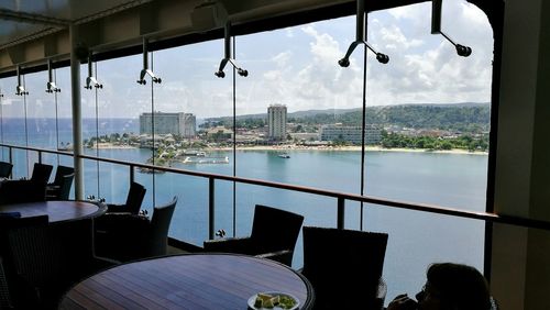 Sea and cityscape seen through window