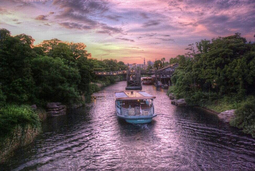 water, tree, sky, transportation, nautical vessel, cloud - sky, waterfront, mode of transport, boat, river, cloudy, sunset, cloud, tranquil scene, tranquility, built structure, nature, beauty in nature, scenics, architecture