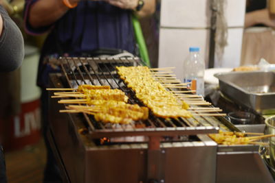 Midsection of man preparing food