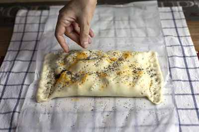 High angle view of person preparing food on table