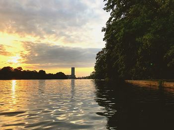 Scenic view of lake against sky during sunset