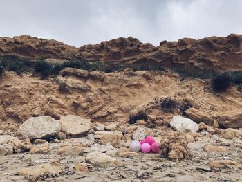 Scenic view of rocks on land against sky