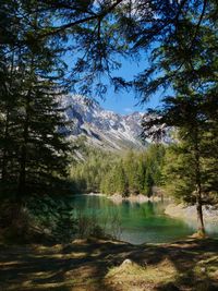 Scenic view of lake and mountains against sky