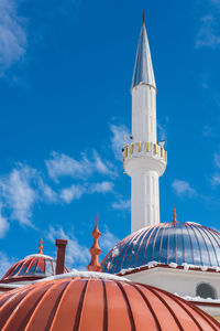 Low angle view of traditional building against blue sky