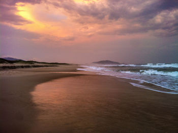 Scenic view of sea against cloudy sky