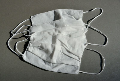 High angle view of mannequin on table against white background