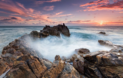 Panoramic view of sea against sky during sunset