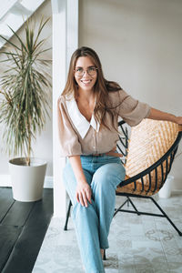 Young woman sitting on chair