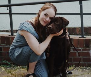 Portrait of woman with dog