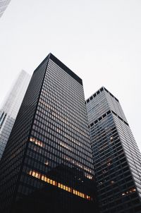 Low angle view of modern buildings against clear sky