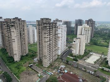 High angle view of buildings in city against sky