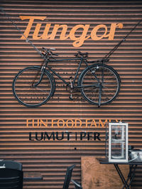 Low angle view of bicycle sign on wall