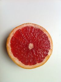 Close-up of strawberry over white background