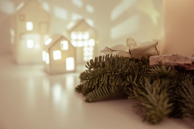 Close-up of illuminated christmas tree at home