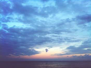 Scenic view of sea against cloudy sky