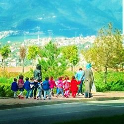 People walking on road in city