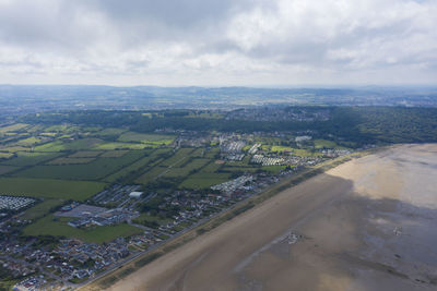 Aerial view of city buildings against sky