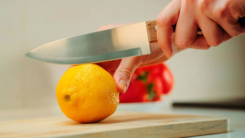 Midsection of man preparing food on table